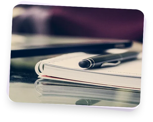 Pink notebook with pen